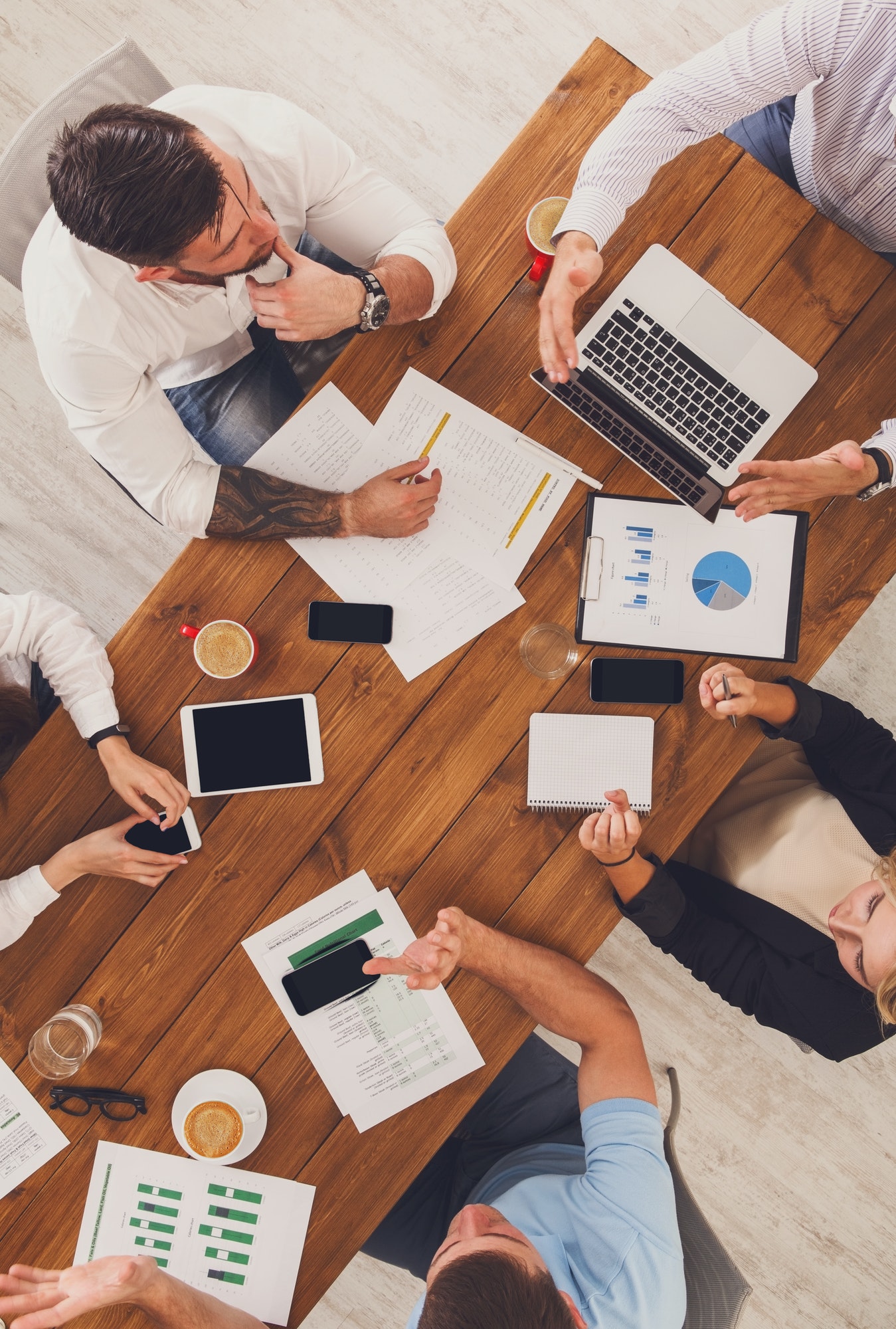 Group of busy business people working in office, top view